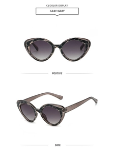 Front and side view of cat eye tortoise shell sunglasses with purple gradient lenses