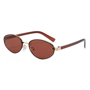 Lunettes de soleil ovales rétro avec verres bruns et monture métallique dorée élégante
