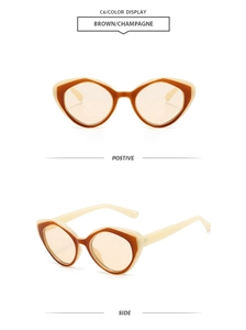 Detail view of cat eye sunglasses in two-tone brown and champagne frame with brown lenses