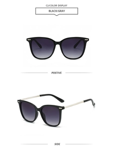 Detail of square oversized sunglasses with black frames and metallic woven temple design