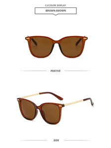 Detail of square oversized brown sunglasses with golden woven metal temples design