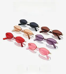 Flat lay of rimless geometric sunglasses in six trendy colors with slim metal frame details