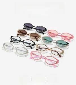 Flat lay of stylish geometric sunglasses in various colors with metallic frames