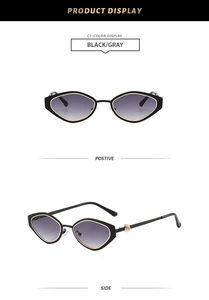 Detail of black cat-eye sunglasses with gold flower relief and gray gradient lenses