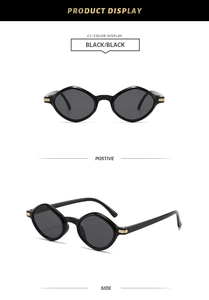 Detail view of black geometric sunglasses showing stylish gold metal temple accents