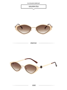 Detail view of gold geometric cat-eye sunglasses with rose hinge and tea gradient lenses