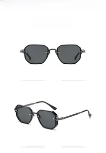 Macro view of geometric polygon sunglasses with metallic frames and dark gray lenses