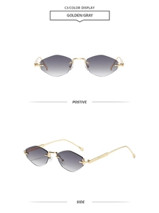 Détails des lunettes de soleil sans monture en métal avec branches dorées et verres gris