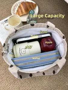 Spacious interior of beige corduroy polka dot tote bag showing large storage capacity