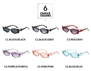 Detailansicht von sechs Fledermaus-Sonnenbrillen in Schwarz, Rot, Violett, Rosa und Blau