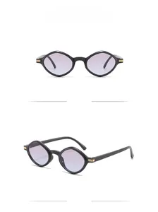Detail view of geometric polygon sunglasses with purple gradient lenses and gold accents