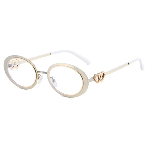 Fashionable oval metal sunglasses with classic gold frames and heart temple detail