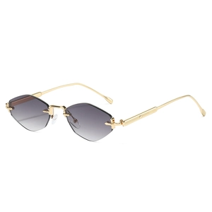 Lunettes de soleil sans monture à verres dégradés géométriques et monture en métal doré