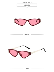 Vue détaillée des lunettes de soleil œil-de-chat rouges avec verres roses et branches en métal