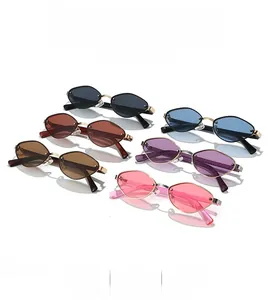 Close-up of hexagonal rimless sunglasses in multiple colors with gold metal frames