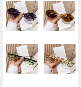 Detail view of oval metal sunglasses in nickel, gold, and gunmetal frames with tinted lenses