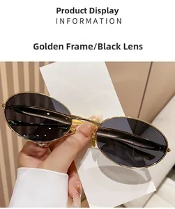 Detailed view of oval metal frame sunglasses with gray lenses and golden finish