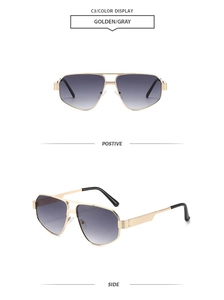 Detail view of golden double-bridge aviator sunglasses with gray gradient lenses