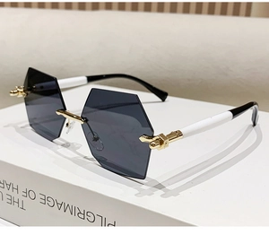 Details einer randlosen sechseckigen Sonnenbrille mit Verlaufsgläsern und Goldmetall