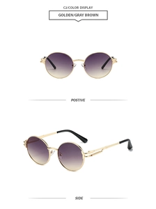 Détail de lunettes de soleil punk rondes rétro avec monture dorée et verres dégradés