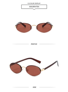 Detail view of oval rimless sunglasses with golden metal bridge and tea-tinted lenses