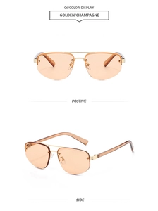 Close-up of rimless polygon sunglasses with gold metal double bridge and gradient lenses