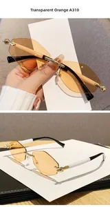 Détail de lunettes de soleil sans monture orange transparent avec branches en métal doré