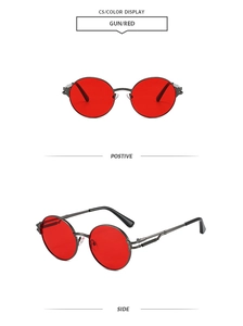 Détail de lunettes de soleil punk rondes avec monture en métal et verres rouges