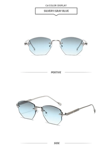 Detail view of rimless polygon sunglasses with silver metal temples and grey-blue lenses