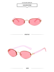 Detail view of oval pink rimless sunglasses with golden metal bridge and clear pink temples