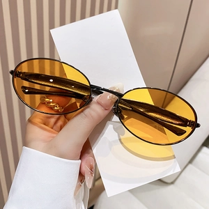 Fashionable oval metal frame sunglasses with yellow lenses for a stylish retro look