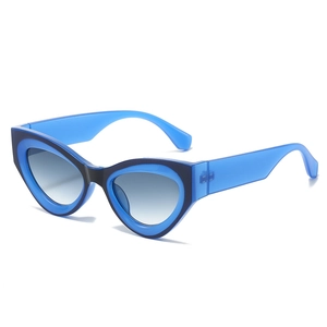Retro cat-eye sunglasses with royal blue thick frames and blue gradient lenses