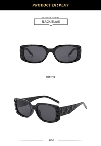 Detailansicht der schwarzen quadratischen Sonnenbrille mit geometrisch facettiertem Rahmen
