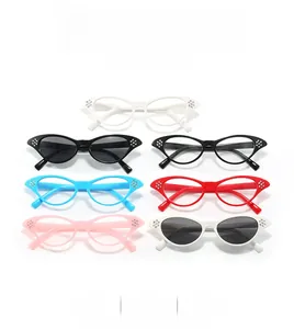 Close-up of retro cat eye sunglasses featuring rhinestone studs in multiple color options