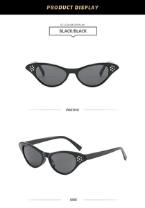 Detail of vintage cat-eye sunglasses with rice nail accents and dark tinted lenses
