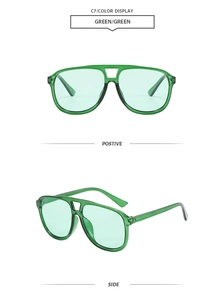Front and side view of green oversized pilot sunglasses with translucent resin frame