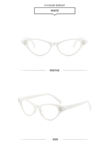 Detail view of white cat-eye sunglasses featuring elegant rhinestone accents on the frame