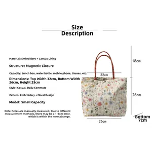 Size guide for floral embroidered canvas tote showing dimensions and magnetic buckle feature
