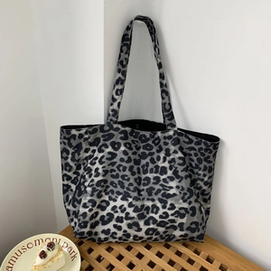 Detail of grey leopard print tote bag in durable canvas with spacious interior design