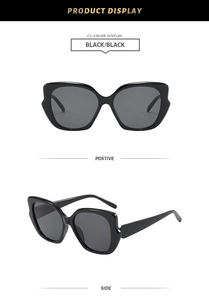 Front and side view of black cat-eye sunglasses with UV protection and oversized frame