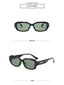 Detail view of black rectangular sunglasses with dark green lenses and silver side accents