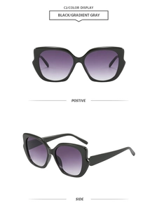 Detailed front and side view of trendy black cat-eye sunglasses with purple gradient lenses
