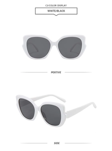 Detailed front and side views of white cat eye sunglasses with dark grey lenses