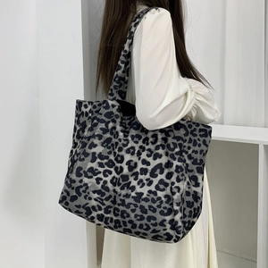 Large leopard print corduroy tote bag for women showing spacious shoulder carry design