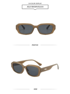 Detail view of jelly brown rectangular sunglasses with black lenses and metal side accents
