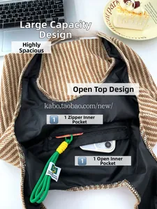 Detail view of large wool tote bag interior with zipper pocket and herringbone pattern