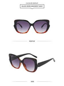 Detailed front and side view of cat eye sunglasses with black demi frames and gradient lenses