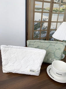 Floral embossed large makeup bag set in white and sage green with zipper closure