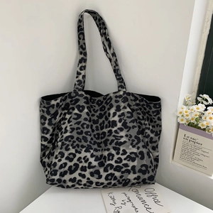 Detail showing high-quality corduroy texture and gray leopard print on large tote bag