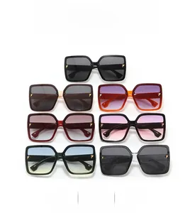 Macro view of square frame sunglasses with gold P-letter hinges in seven color options